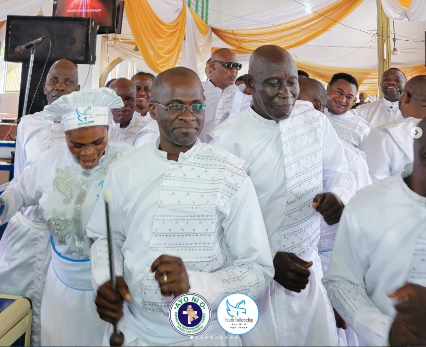 Brethren in white garments processing and rejoicing together during a service