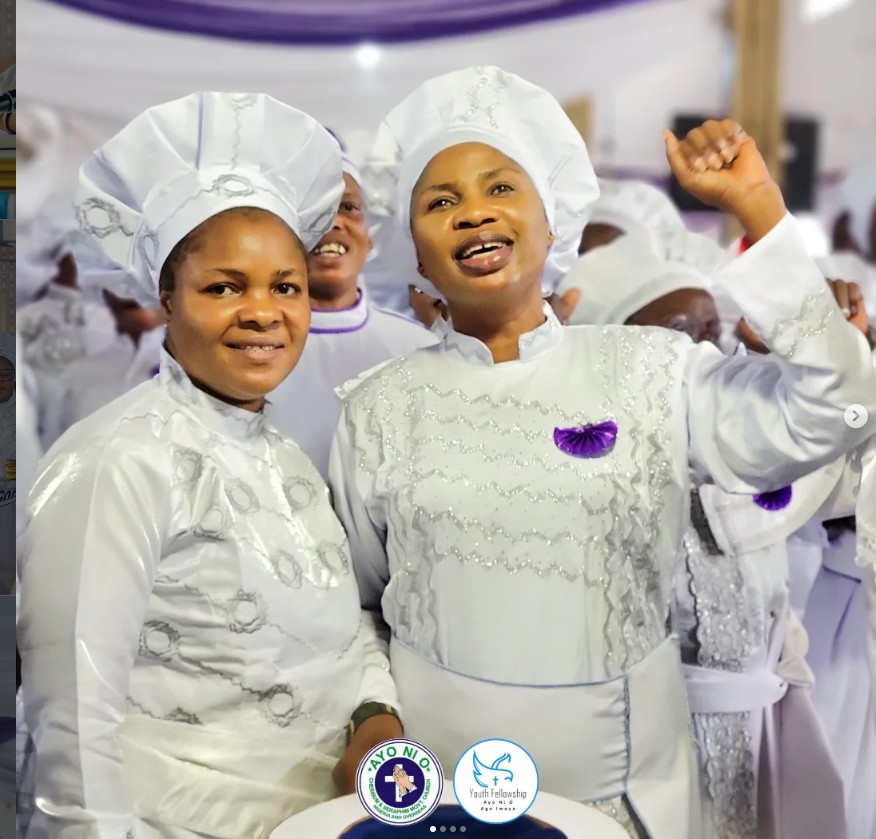 Two women of the church in white and purple fellowship garments rejoicing